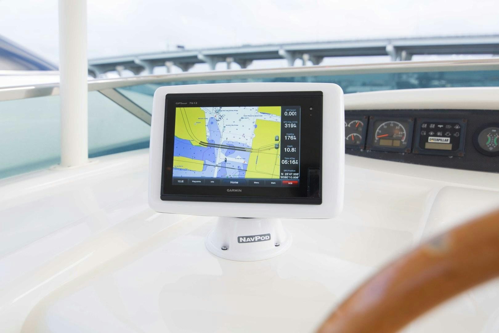 a hand holding a tablet aboard ENCHANTED LADY Yacht for Sale