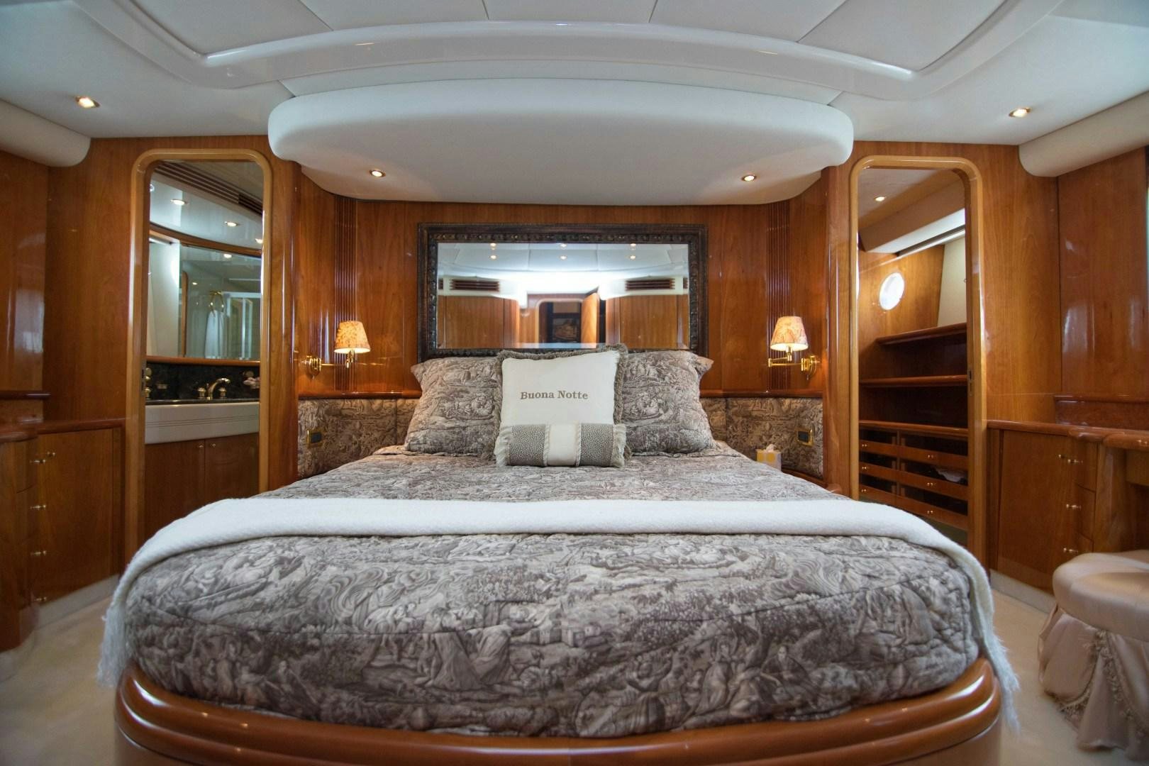 a large bed in a room aboard ENCHANTED LADY Yacht for Sale