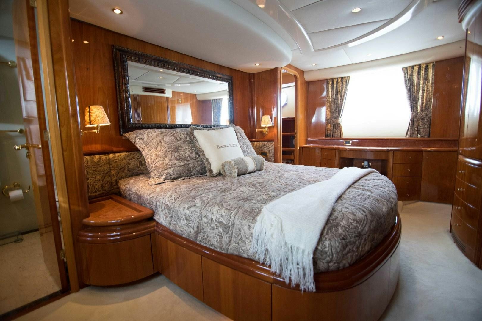 a large bed in a room aboard ENCHANTED LADY Yacht for Sale