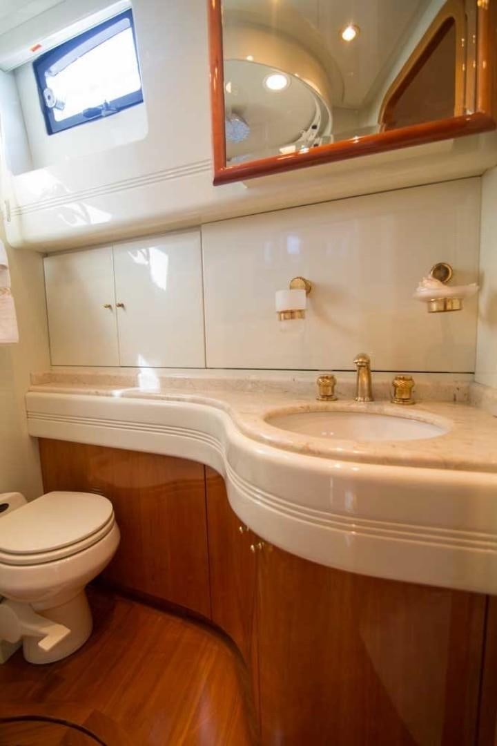 a bathroom with a sink and a toilet aboard ENCHANTED LADY Yacht for Sale