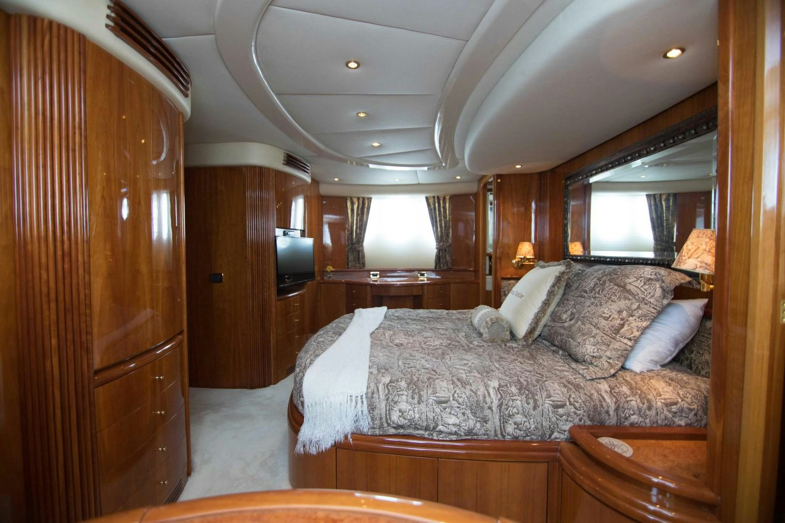 a bed in a room aboard ENCHANTED LADY Yacht for Sale
