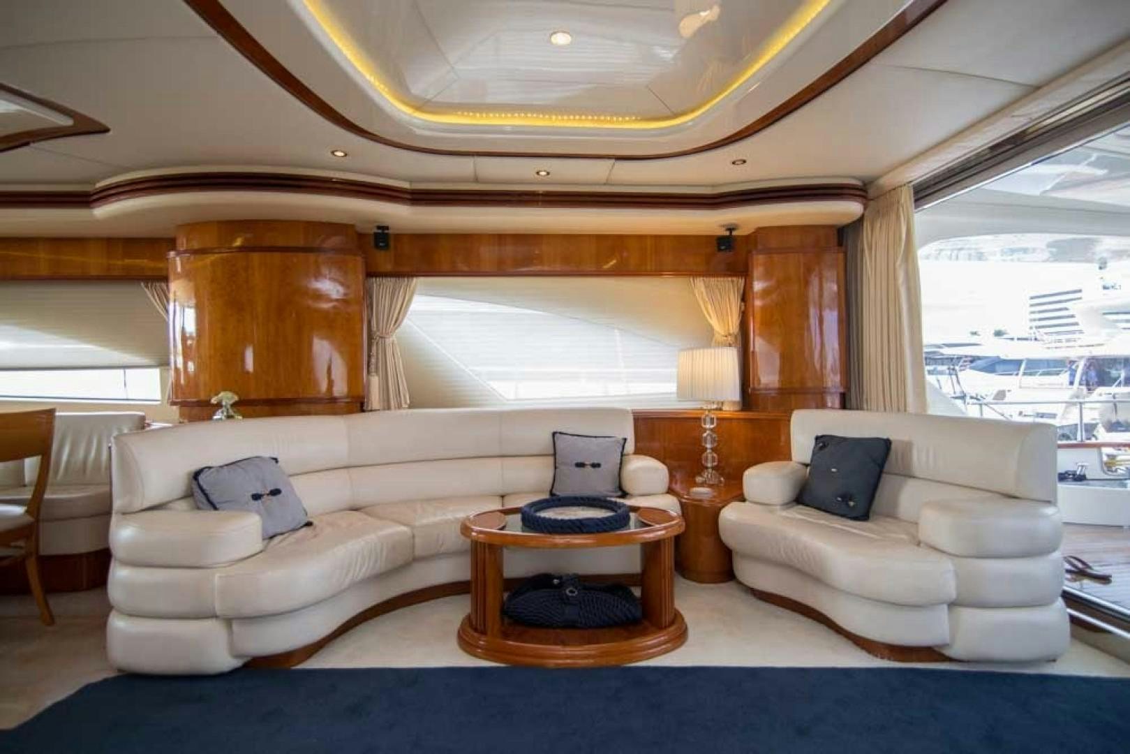 a living room with a large window aboard ENCHANTED LADY Yacht for Sale