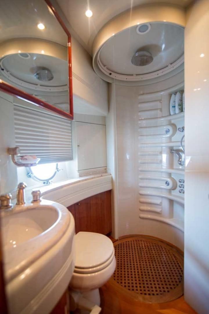 a bathroom with a sink and toilet aboard ENCHANTED LADY Yacht for Sale