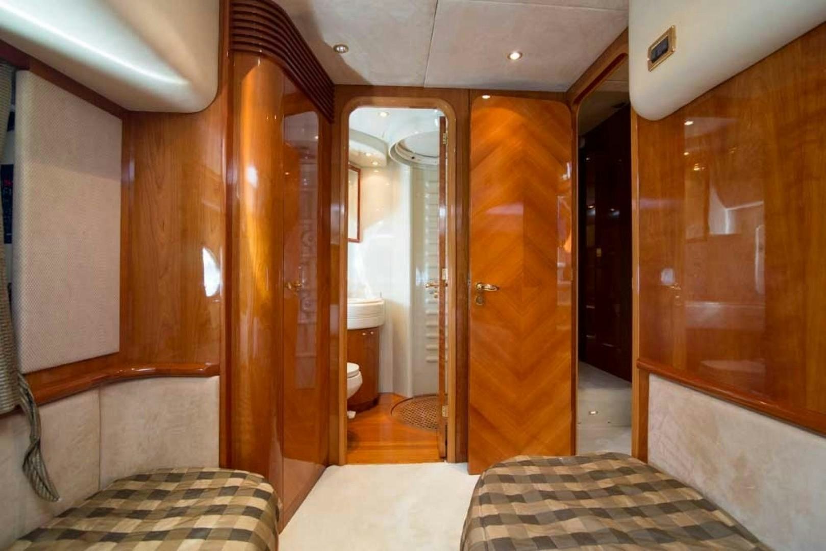 a bathroom with a bed and a mirror aboard ENCHANTED LADY Yacht for Sale