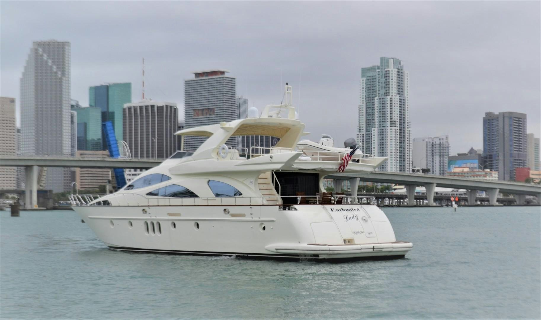 a large white boat in the water aboard ENCHANTED LADY Yacht for Sale