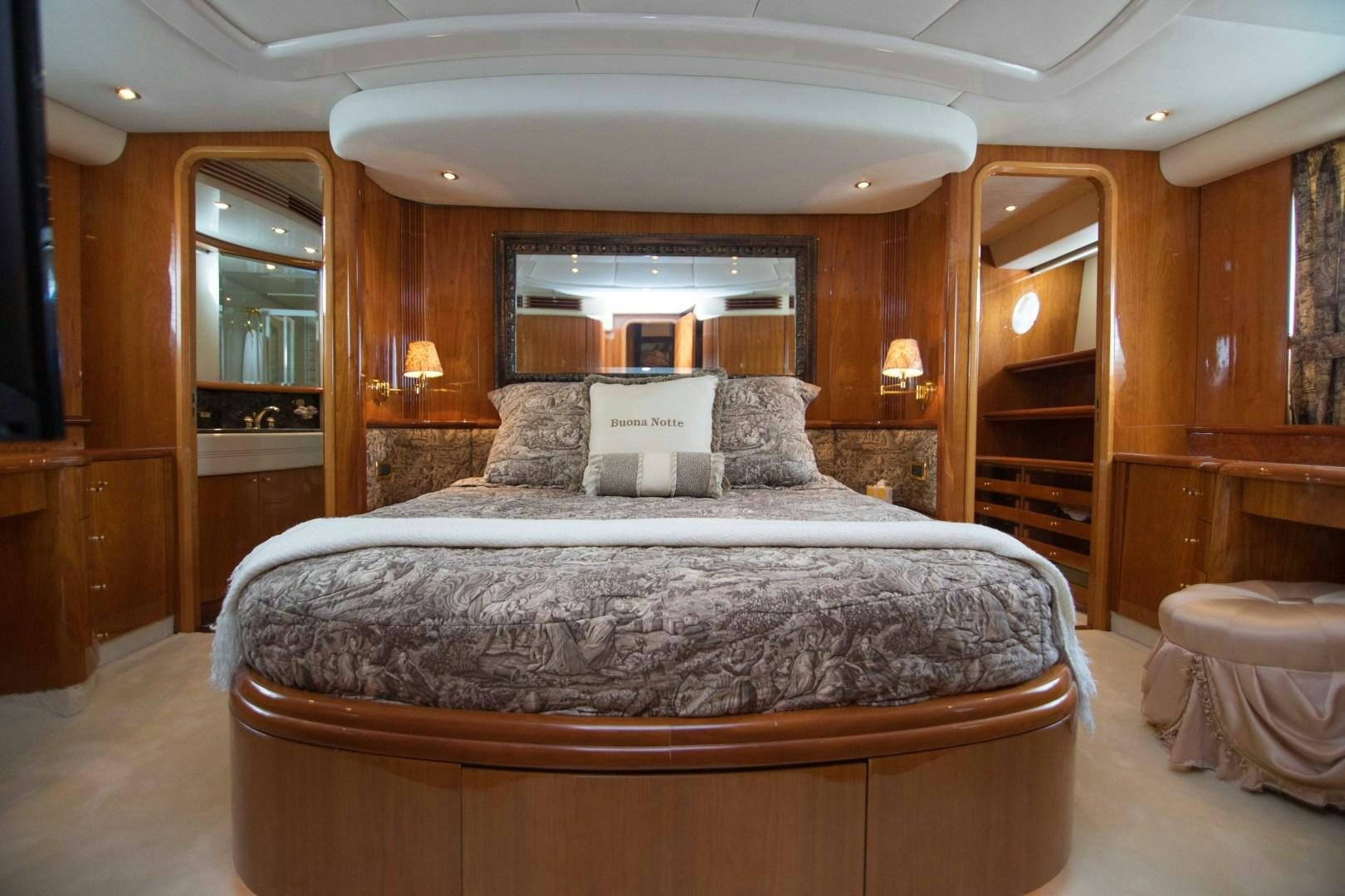 a large bed in a room aboard ENCHANTED LADY Yacht for Sale