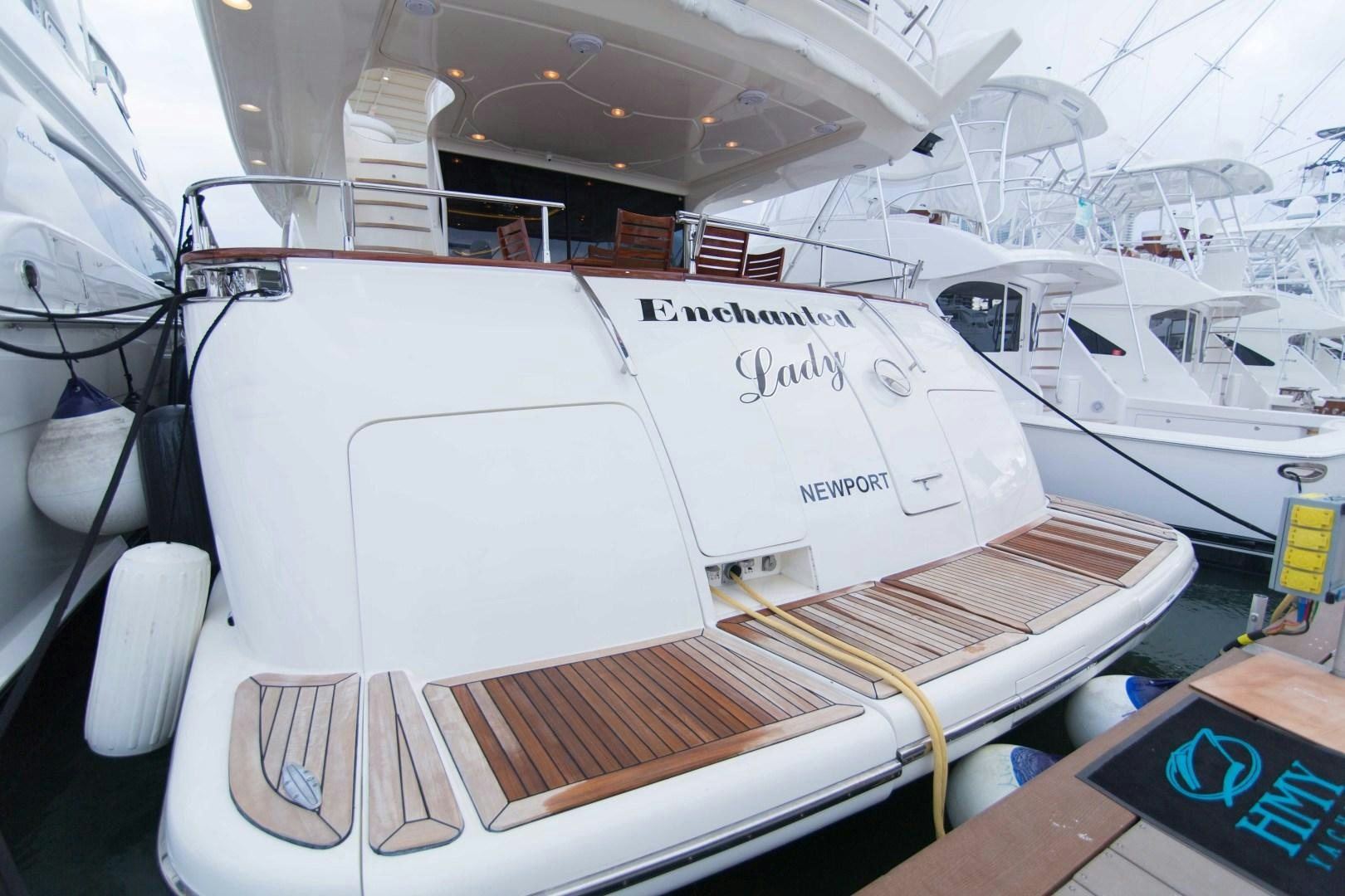a white boat on a deck aboard ENCHANTED LADY Yacht for Sale
