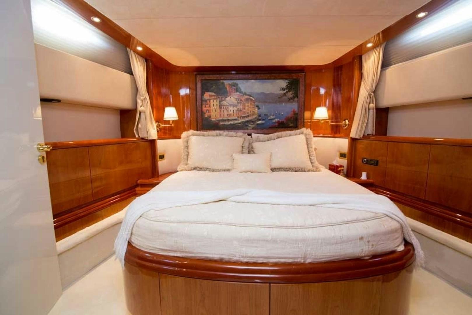 a bed in a room aboard ENCHANTED LADY Yacht for Sale