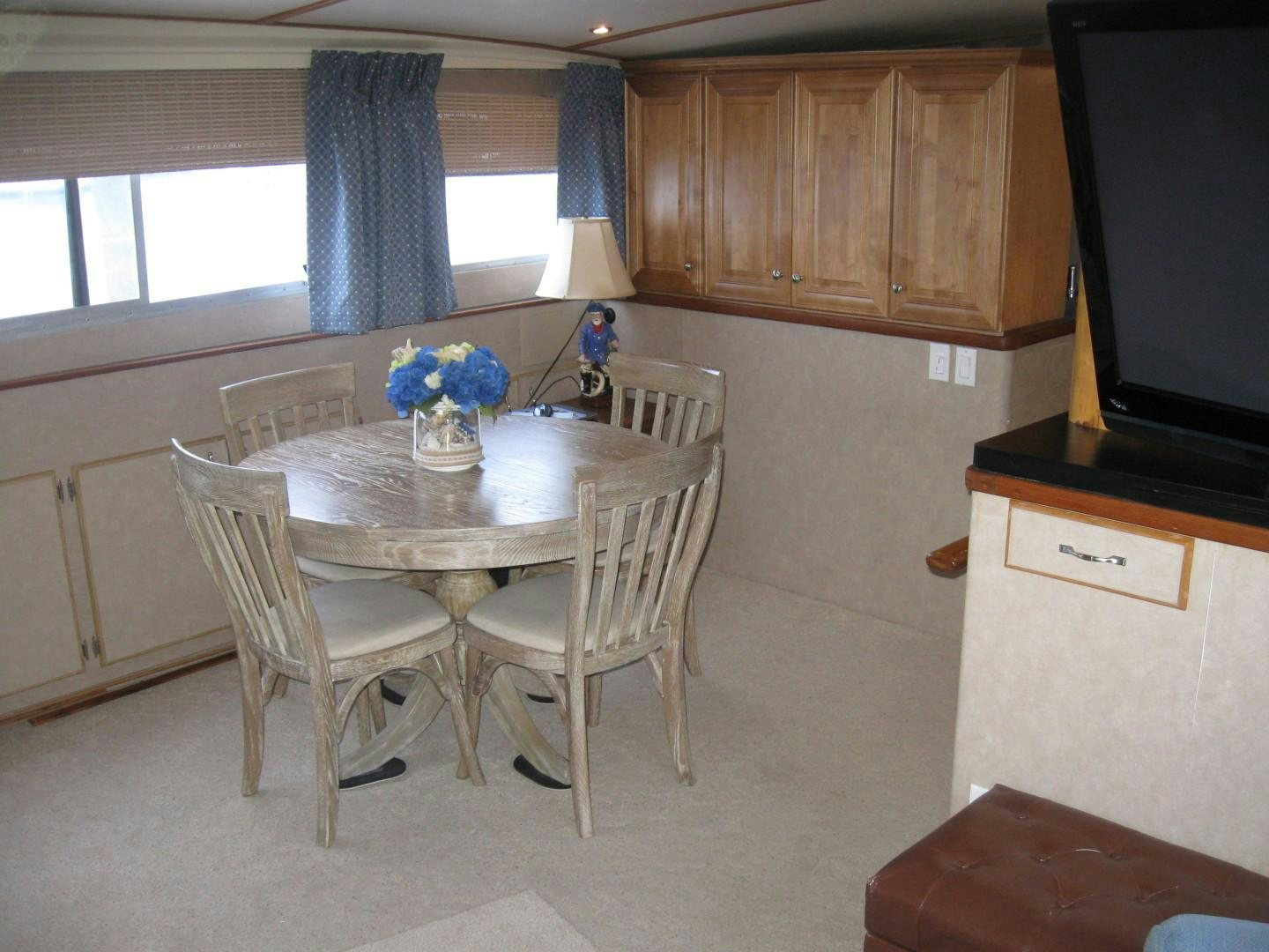 a kitchen with a dining table aboard OCEAN ROMANCE Yacht for Sale