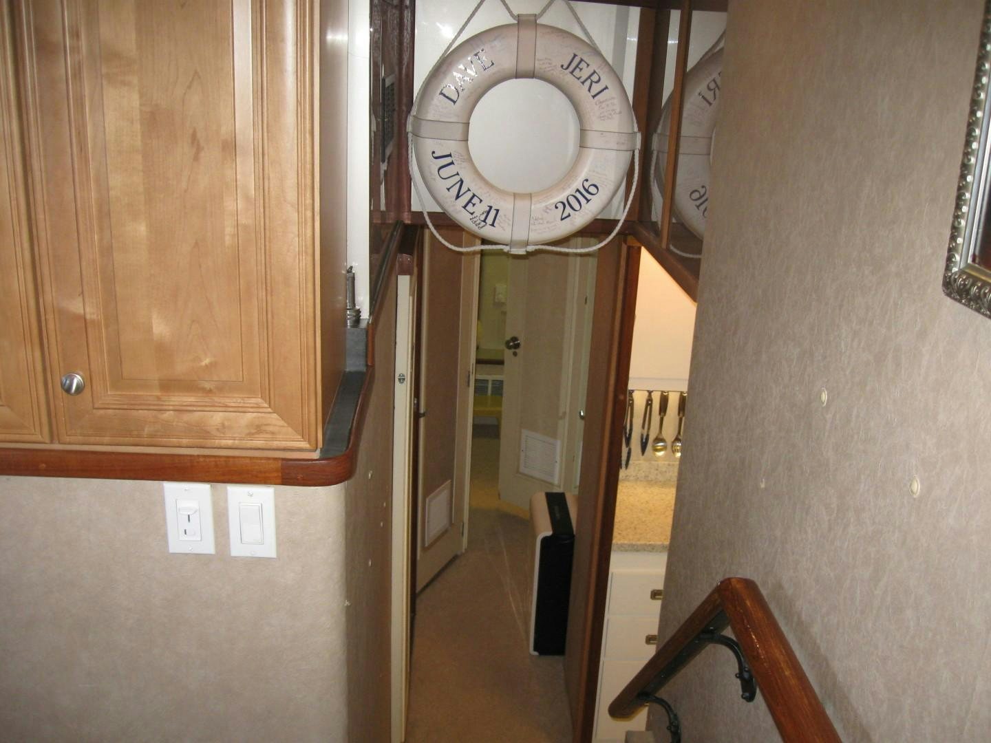 a hallway with a round clock aboard OCEAN ROMANCE Yacht for Sale