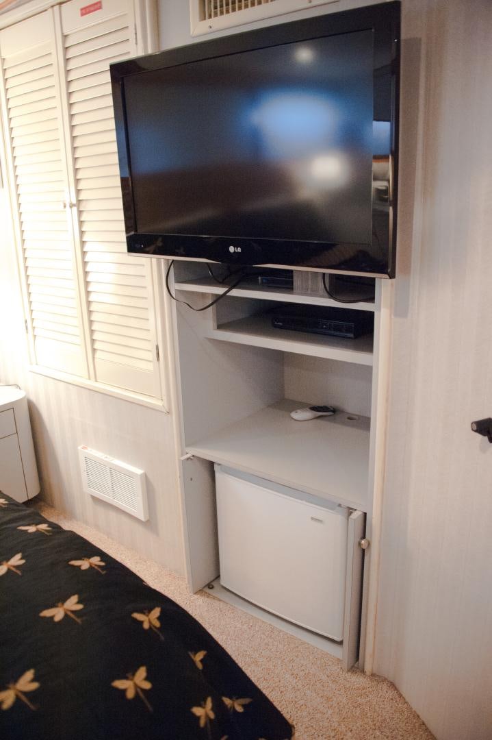 a tv on a shelf aboard OCEAN ROMANCE Yacht for Sale