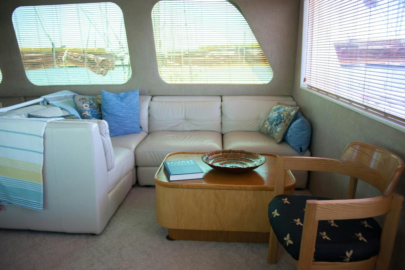 a living room with a couch and a table aboard OCEAN ROMANCE Yacht for Sale