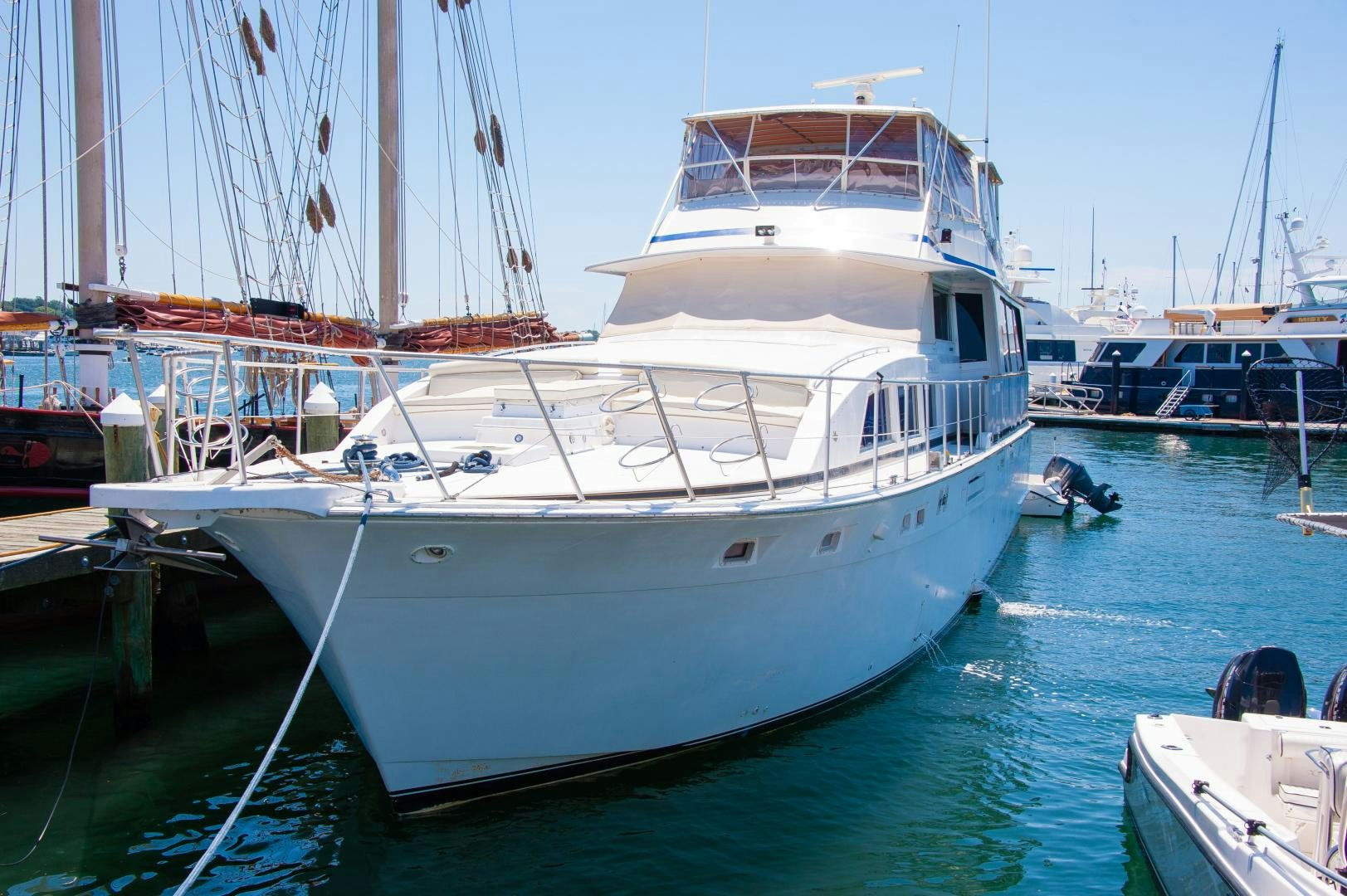 a large white boat in a harbor aboard OCEAN ROMANCE Yacht for Sale