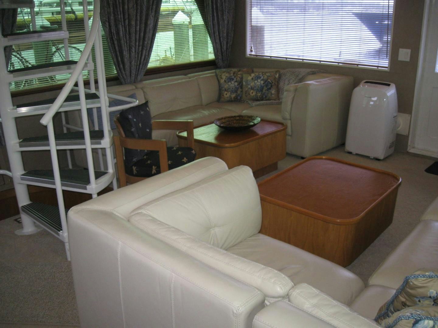 a living room with a couch and a table aboard OCEAN ROMANCE Yacht for Sale