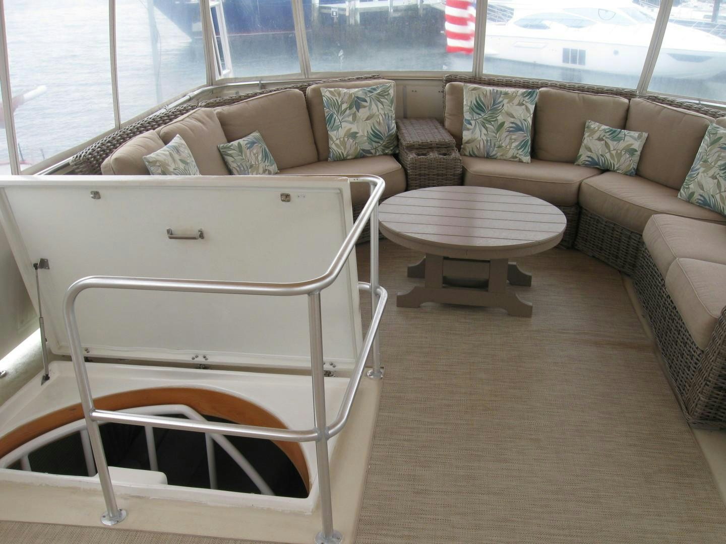 a white chair in a living room aboard OCEAN ROMANCE Yacht for Sale