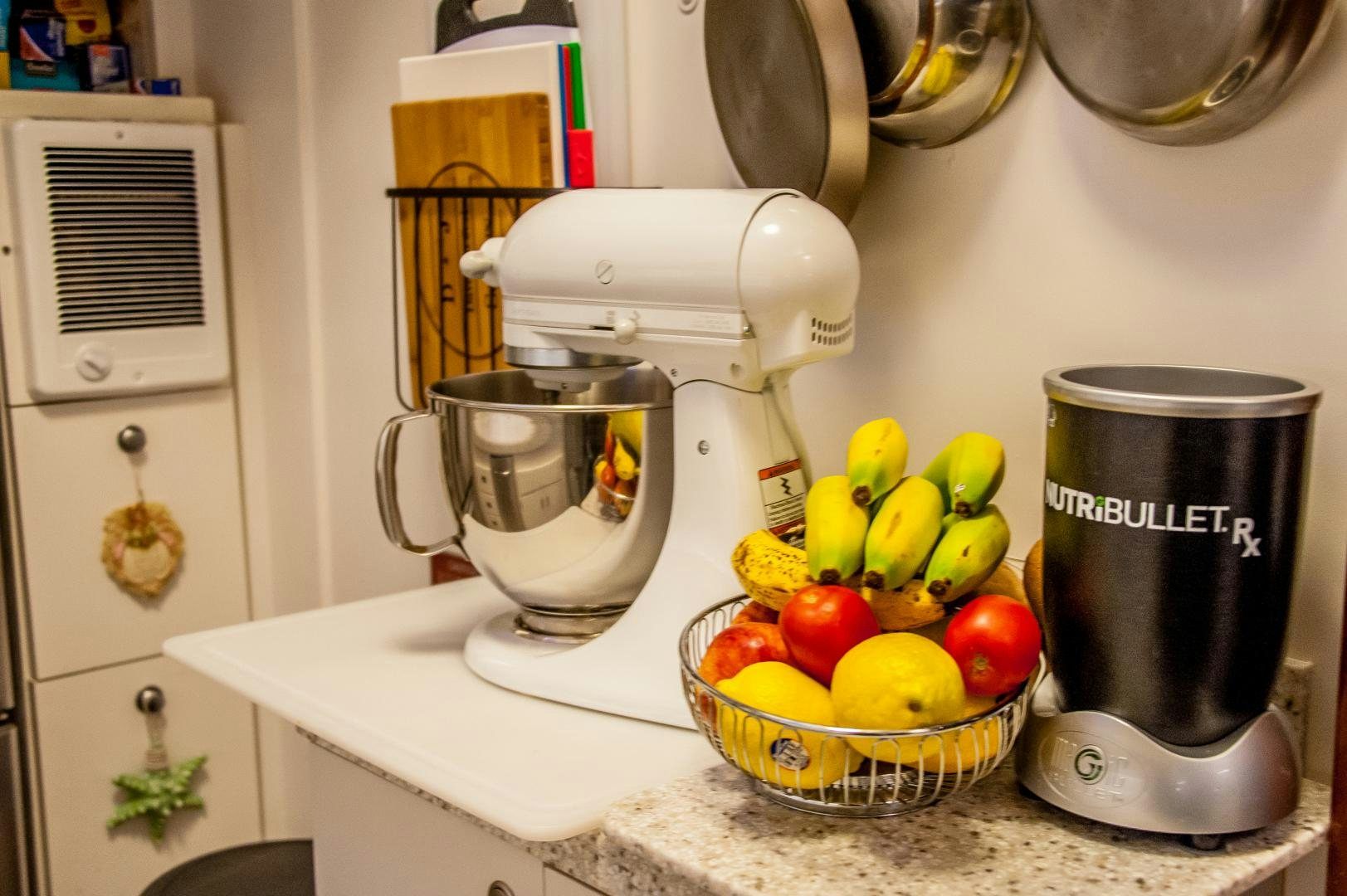 a kitchen counter with fruits and a coffee maker aboard OCEAN ROMANCE Yacht for Sale