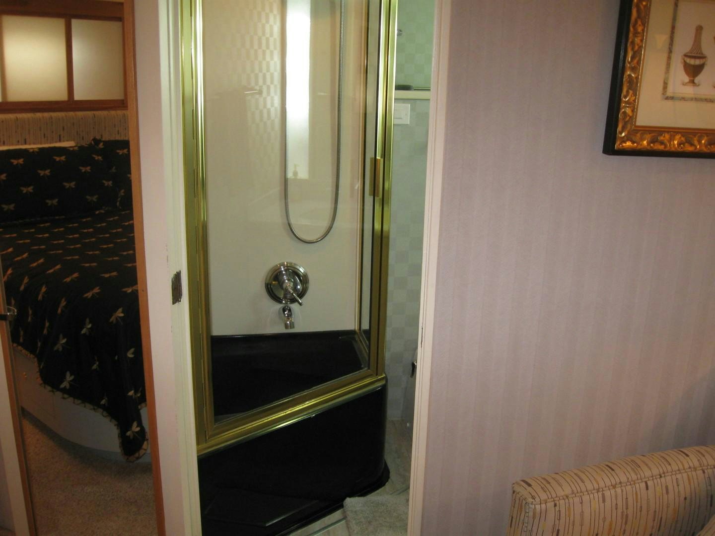 a bathroom with a glass shower aboard OCEAN ROMANCE Yacht for Sale