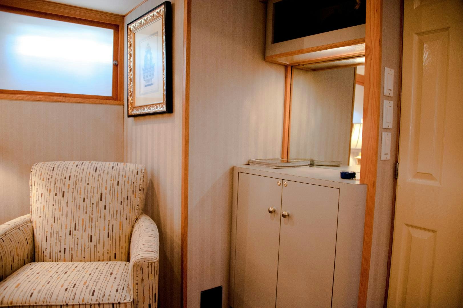 a chair and a couch in a room aboard OCEAN ROMANCE Yacht for Sale