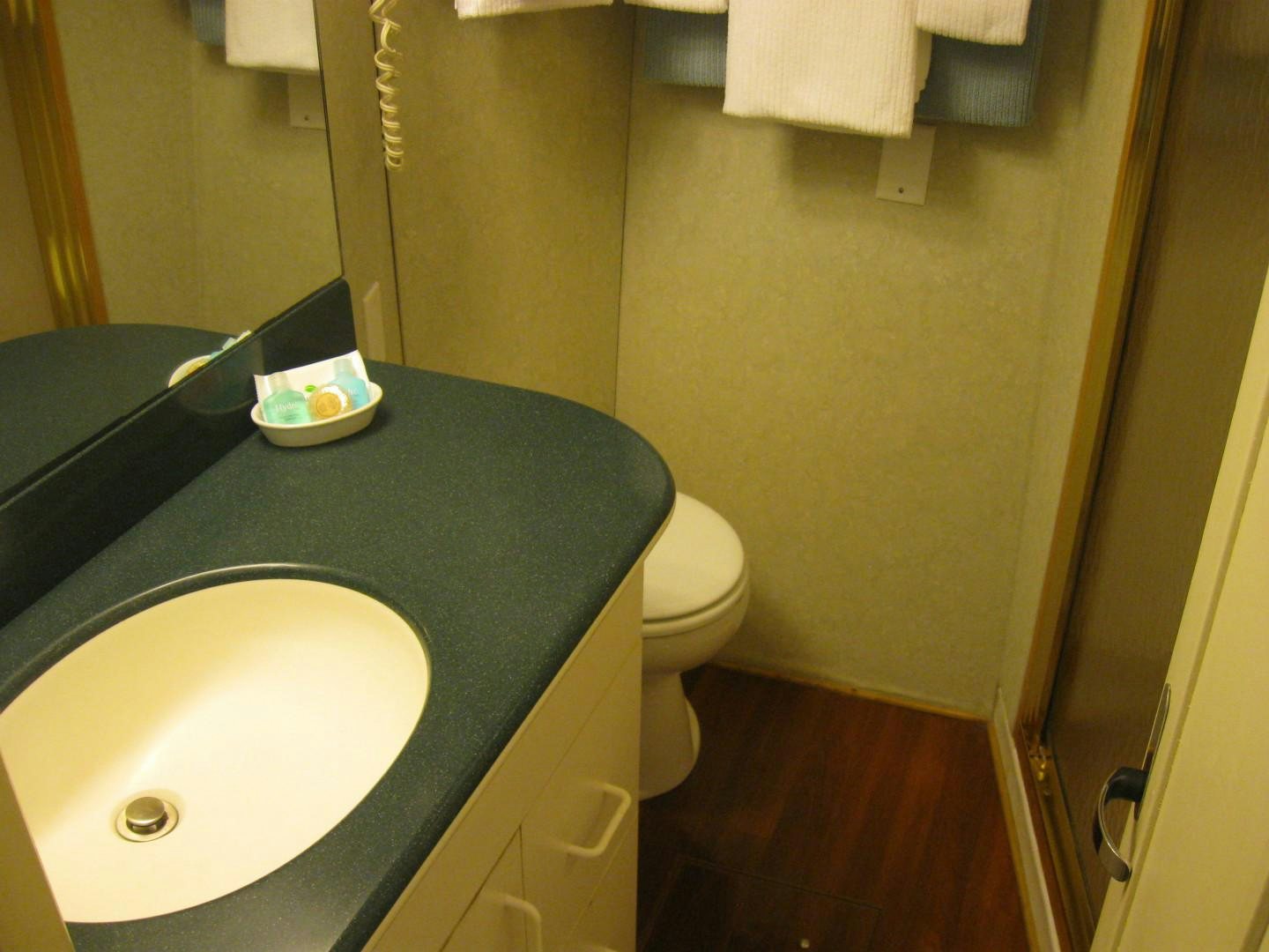 a bathroom with a sink and toilet aboard OCEAN ROMANCE Yacht for Sale