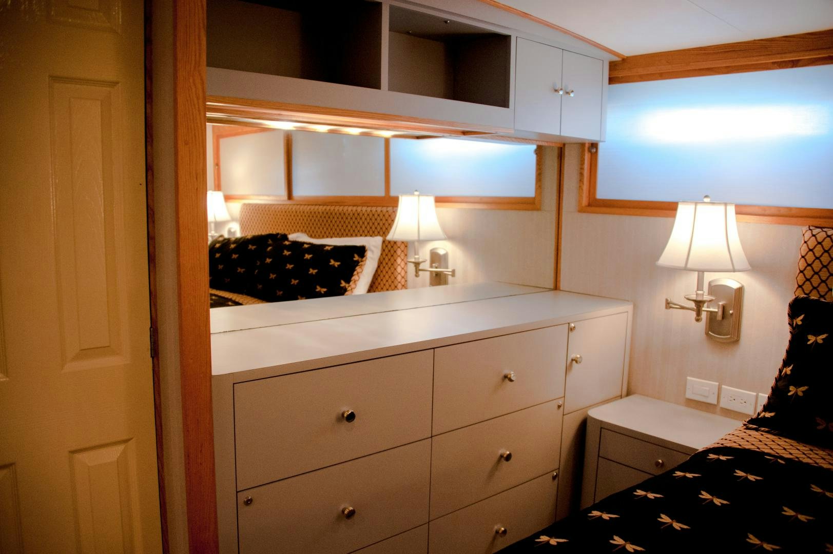 a room with a bed and a lamp on the bed aboard OCEAN ROMANCE Yacht for Sale