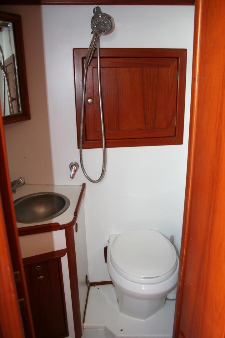a bathroom with a toilet and sink aboard SINDBAD Yacht for Sale