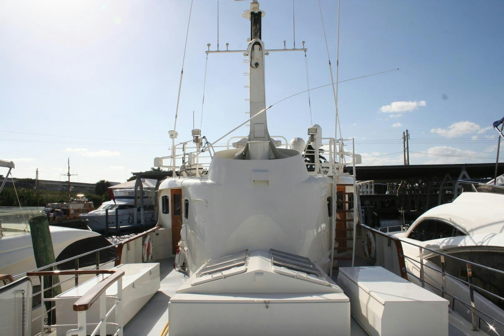 a large white boat in a harbor aboard SINDBAD Yacht for Sale
