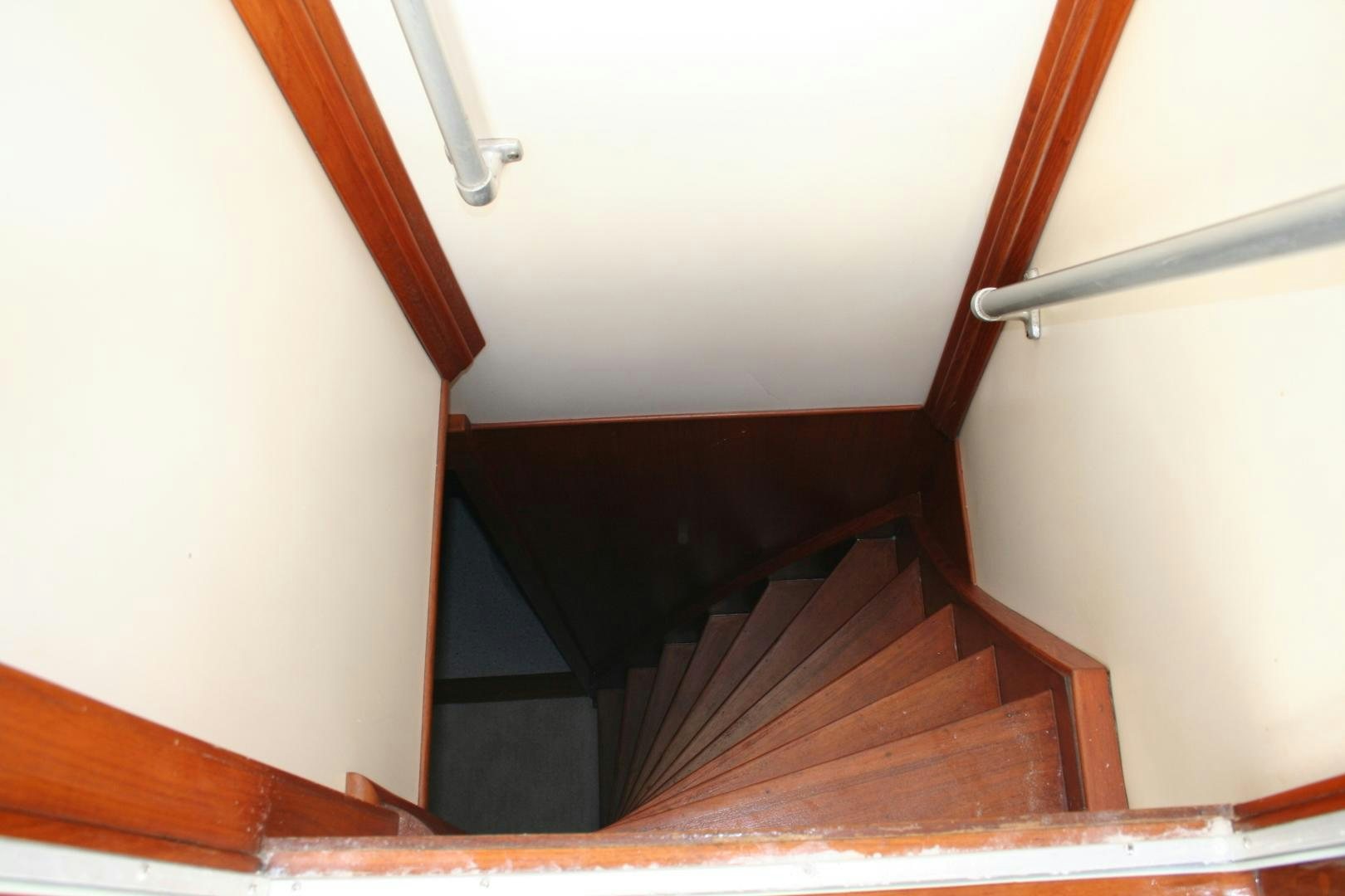 a wooden staircase in a house aboard SINDBAD Yacht for Sale