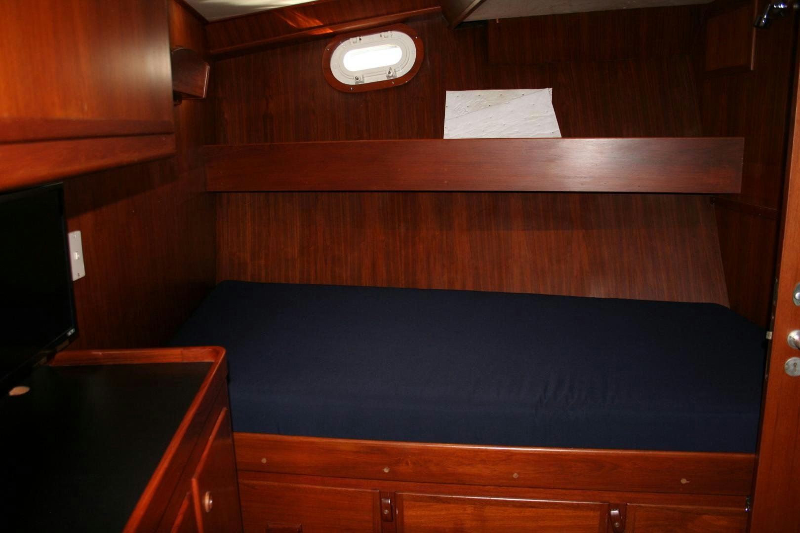 a room with wooden cabinets aboard SINDBAD Yacht for Sale