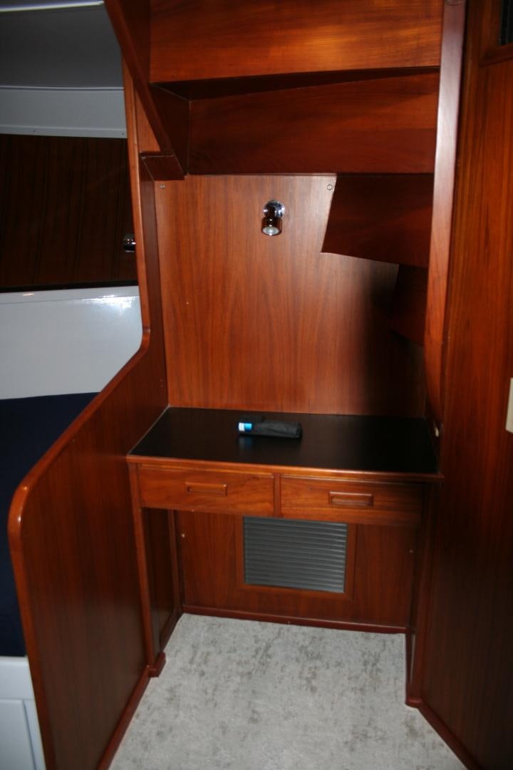 a wooden cabinet with drawers aboard SINDBAD Yacht for Sale