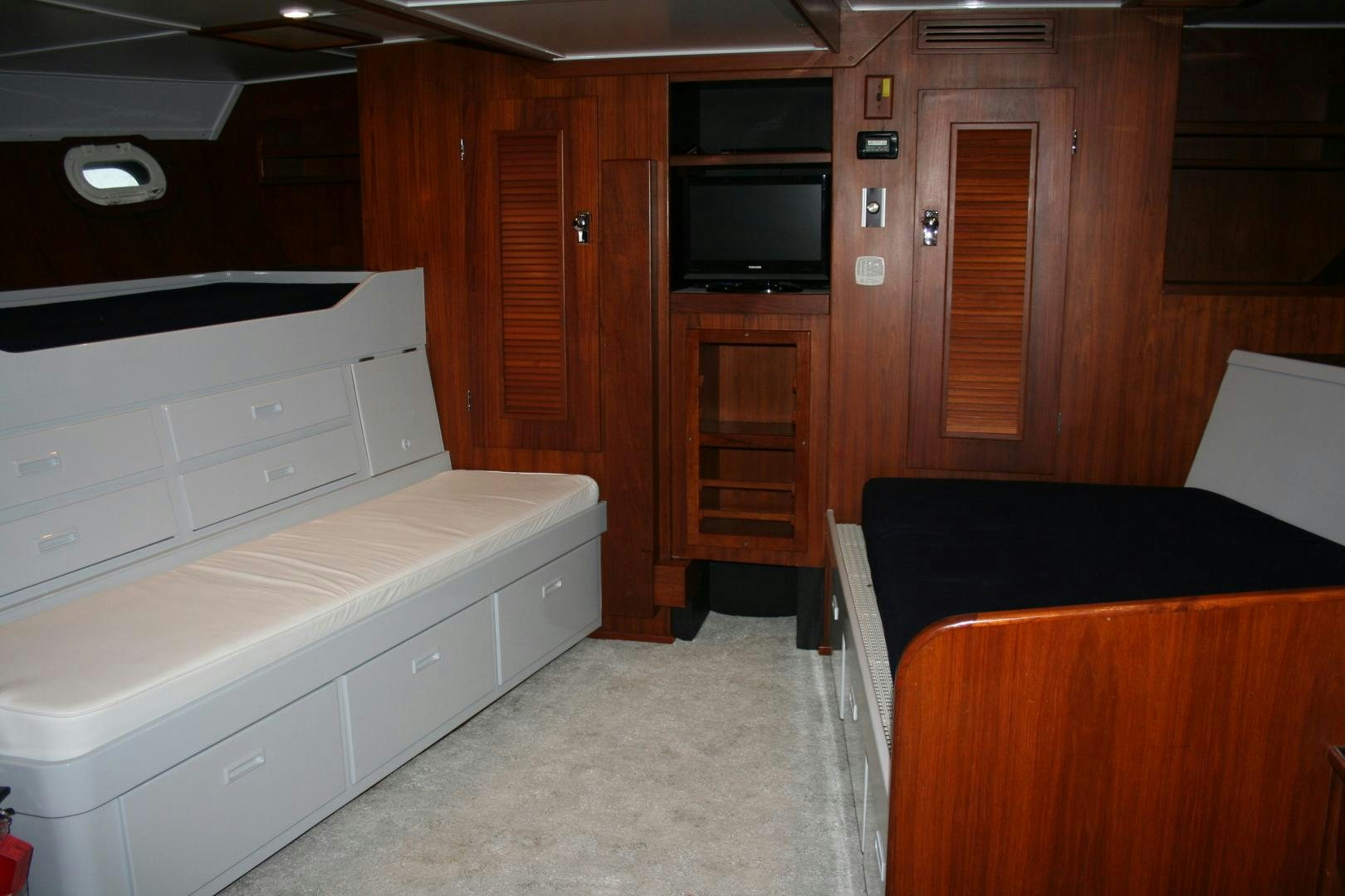 a room with a bed and a tv aboard SINDBAD Yacht for Sale