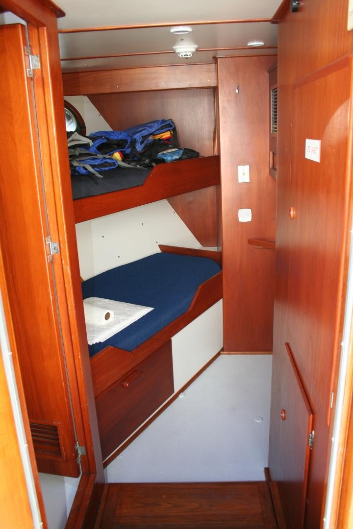 a room with a closet and a bed aboard SINDBAD Yacht for Sale