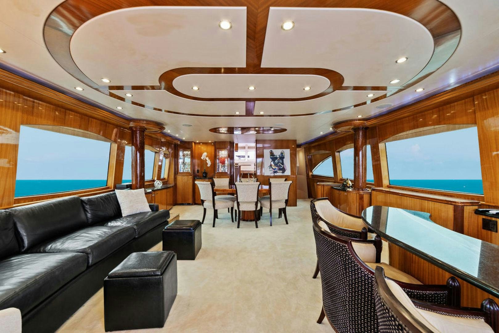a train with a couch and chairs aboard LA MER Yacht for Sale