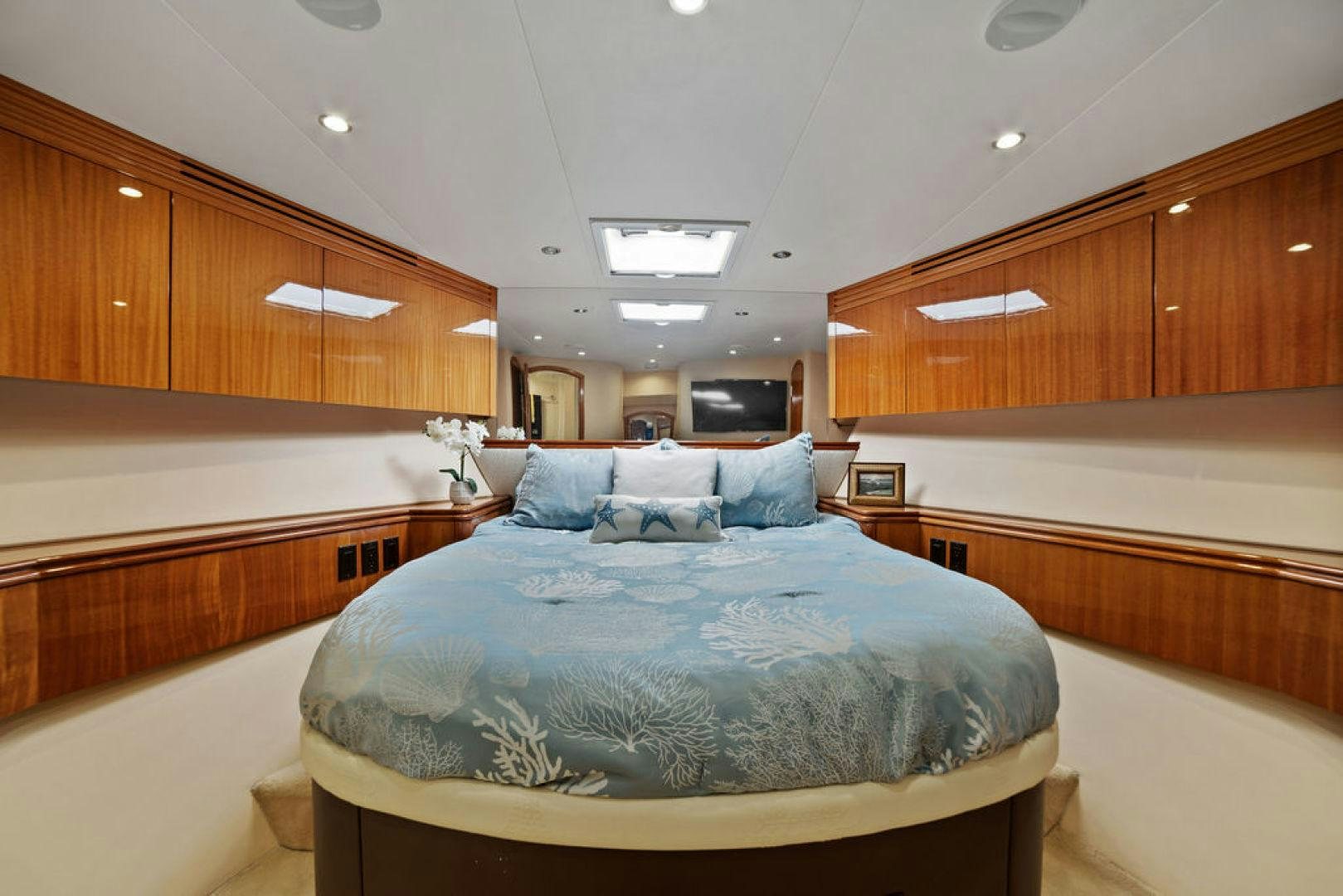 a bed in a room aboard LA MER Yacht for Sale