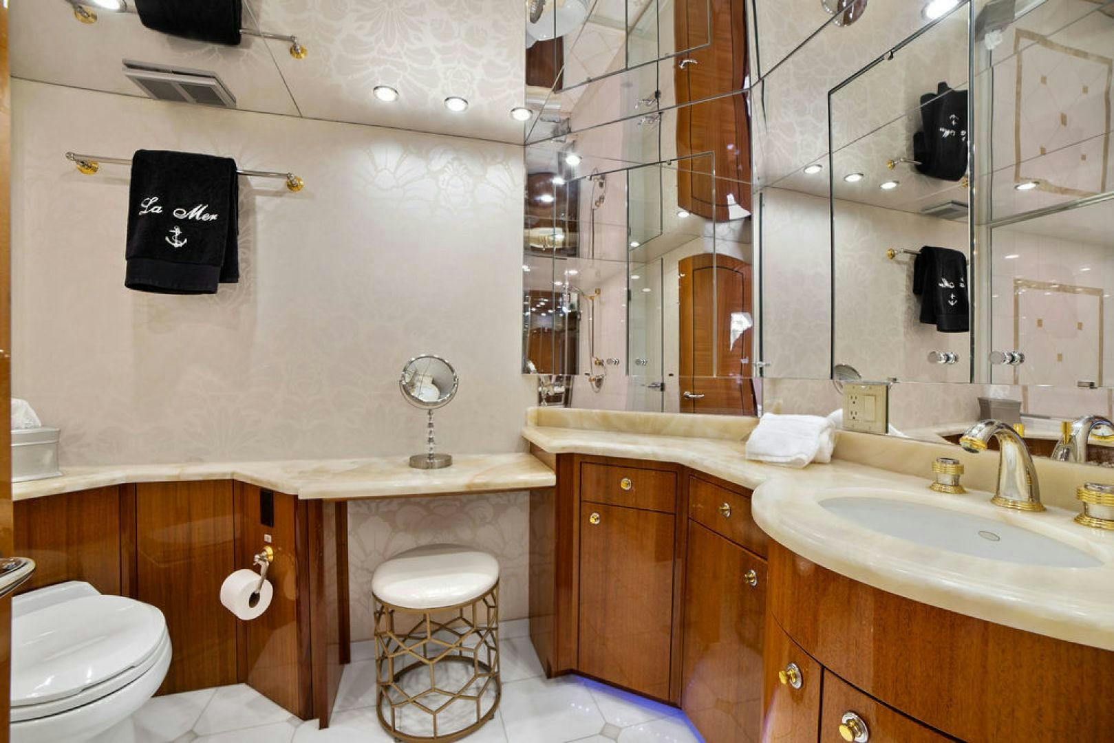 a bathroom with a toilet and sink aboard LA MER Yacht for Sale