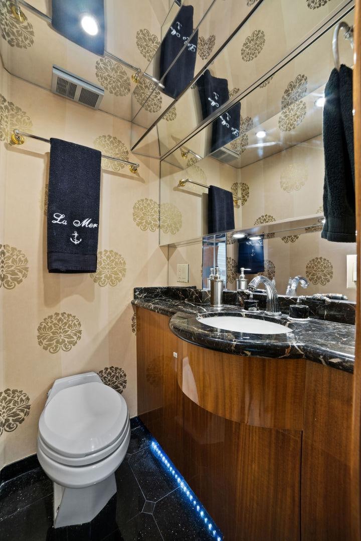 a bathroom with a sink and toilet aboard LA MER Yacht for Sale