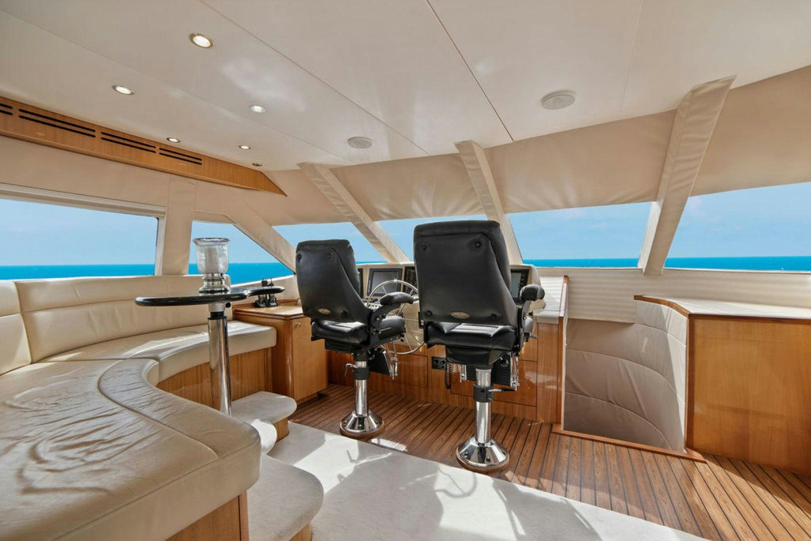 a room with a tv and a chair aboard LA MER Yacht for Sale