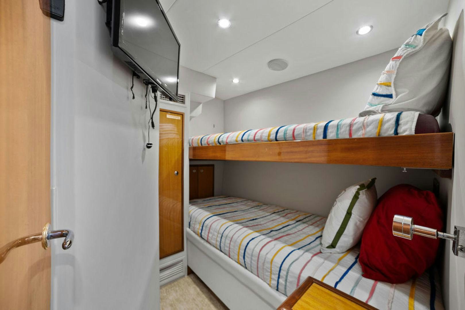 a small bedroom with a bunk bed aboard LA MER Yacht for Sale