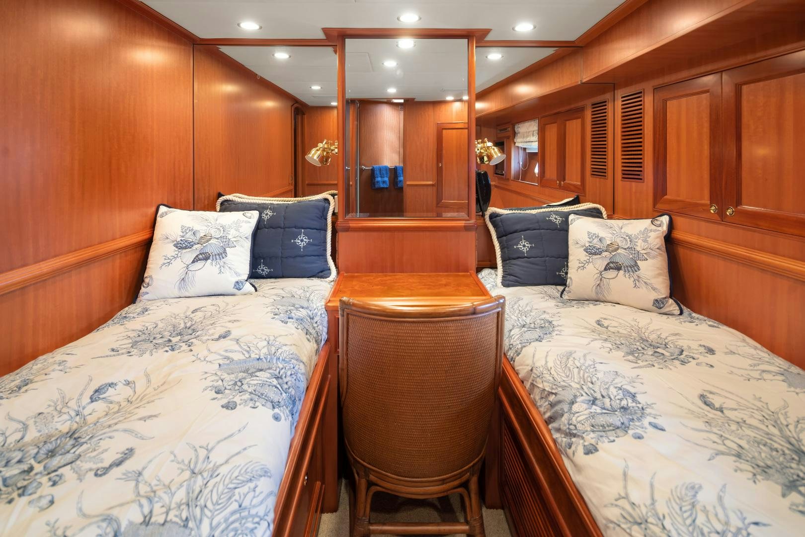 a room with wooden furniture aboard CAPTIVA Yacht for Sale