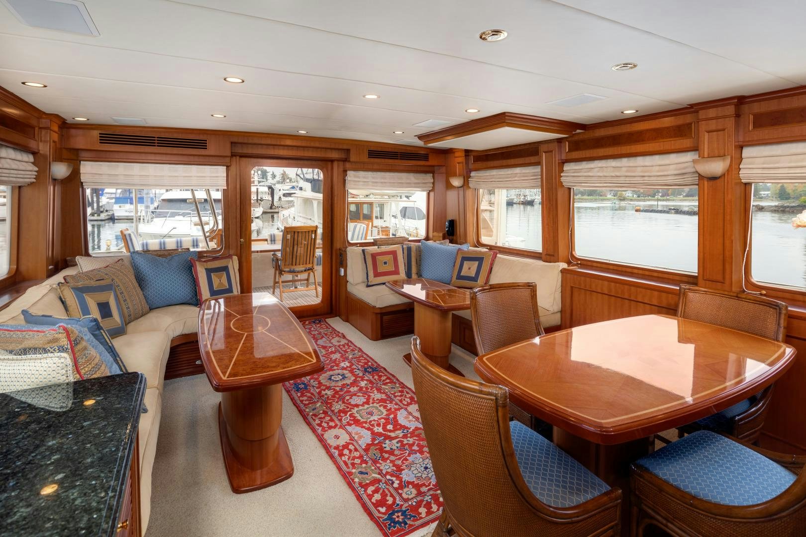 a living room with a table and chairs aboard CAPTIVA Yacht for Sale