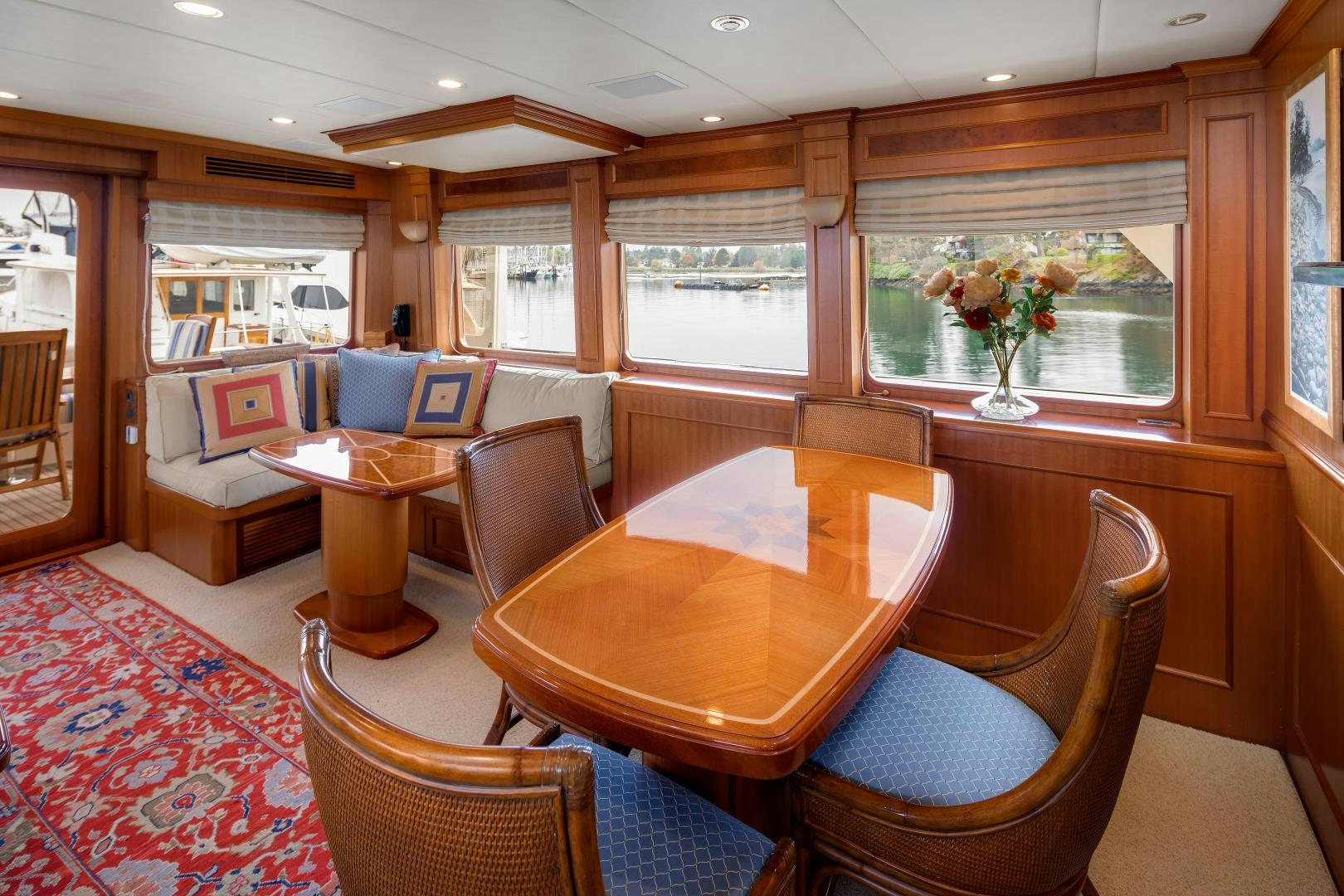 a dining room with a table and chairs aboard CAPTIVA Yacht for Sale