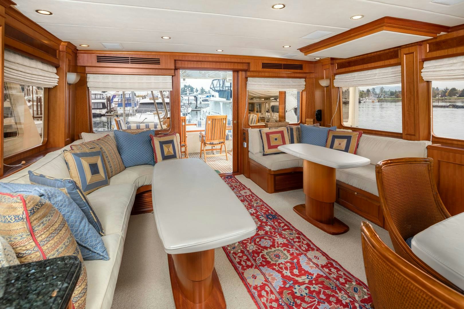 a living room with a large window aboard CAPTIVA Yacht for Sale