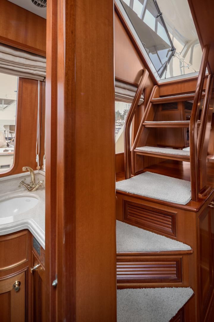 a wooden staircase in a bathroom aboard CAPTIVA Yacht for Sale