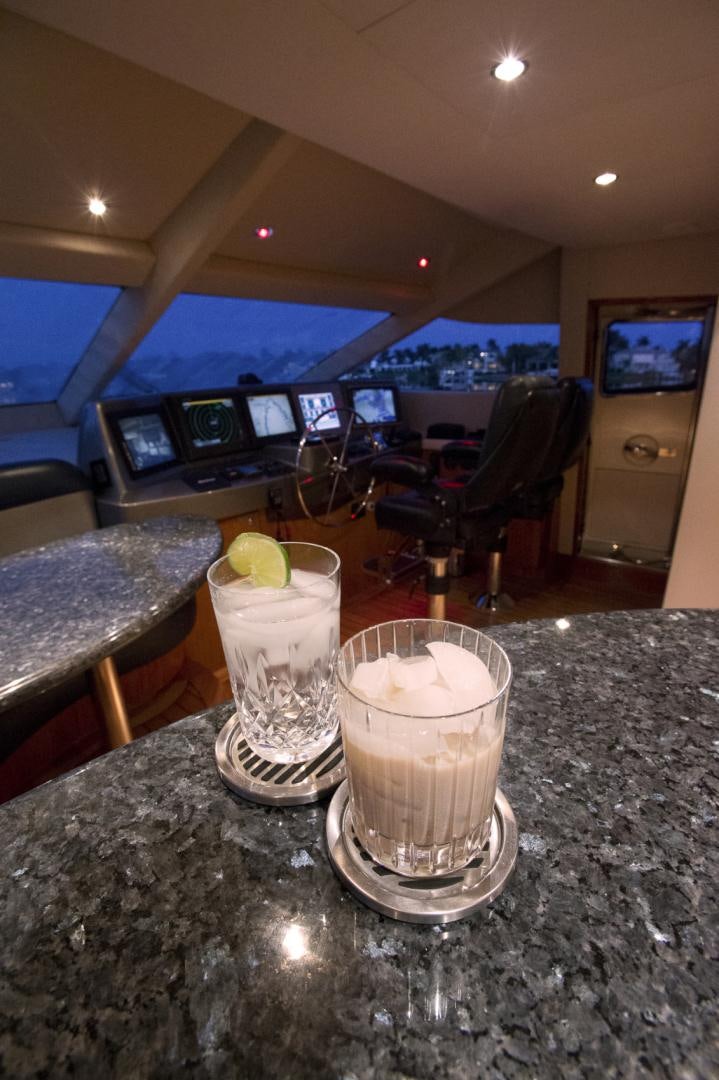 a glass of beer on a table aboard ILLUMINIATION Yacht for Sale