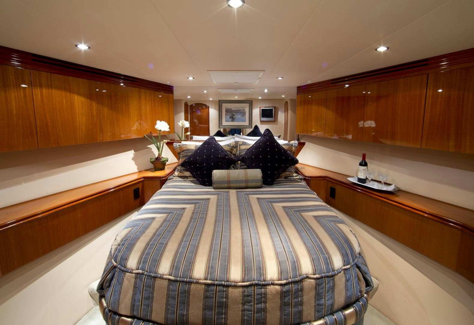 a bed in a room aboard ILLUMINIATION Yacht for Sale
