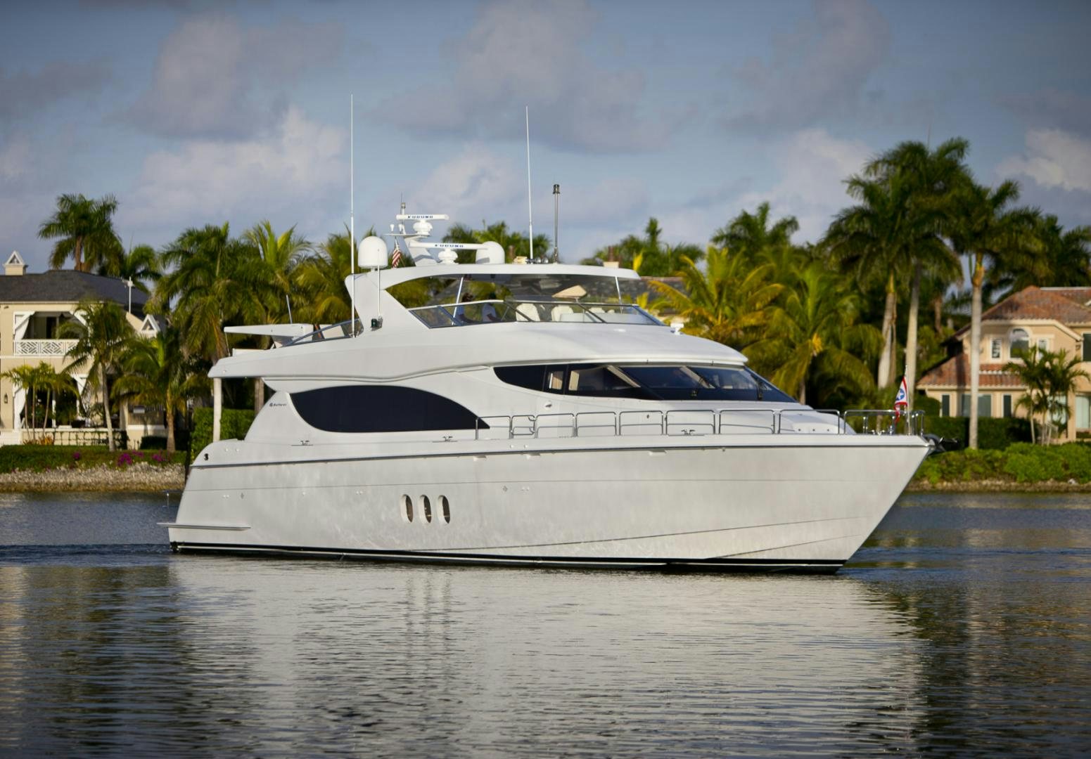 a white yacht on the water aboard ILLUMINIATION Yacht for Sale