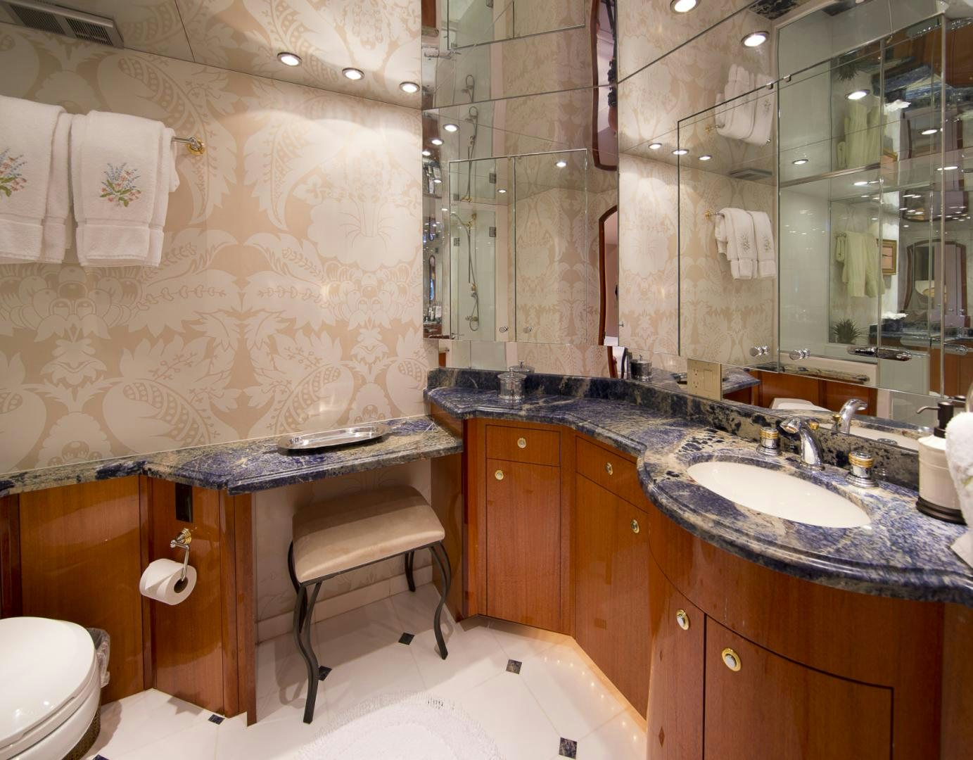 a bathroom with a large mirror aboard ILLUMINIATION Yacht for Sale