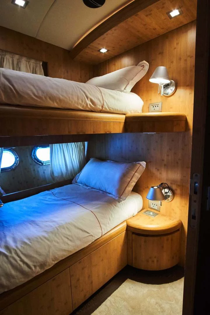 a bed with a large headboard aboard TAYYARAH Yacht for Sale