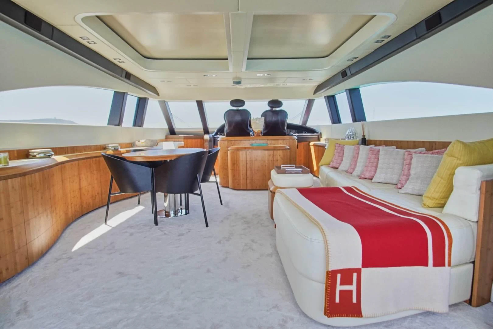 a room with a table and couch aboard TAYYARAH Yacht for Sale