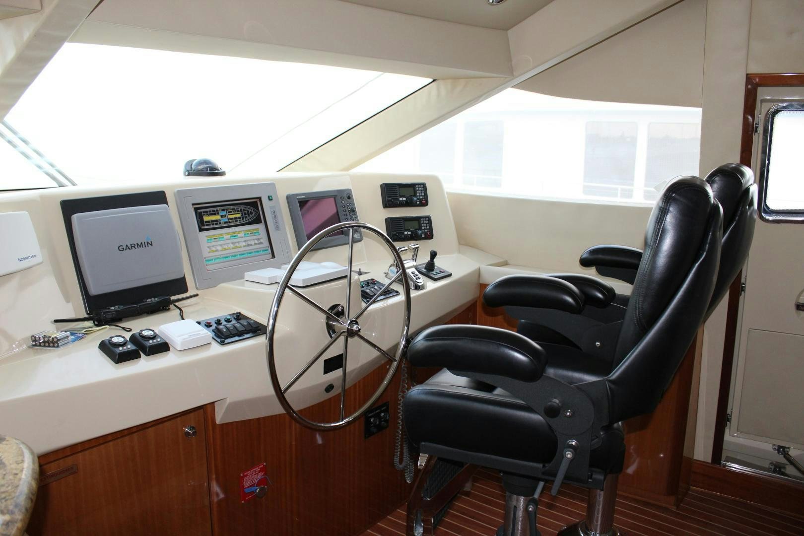 a desk with a computer and a chair aboard No Name Yacht for Sale