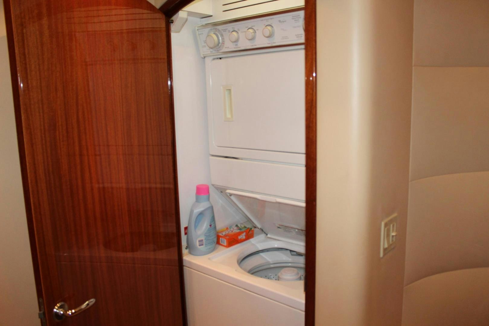 a small kitchen with a washing machine aboard No Name Yacht for Sale